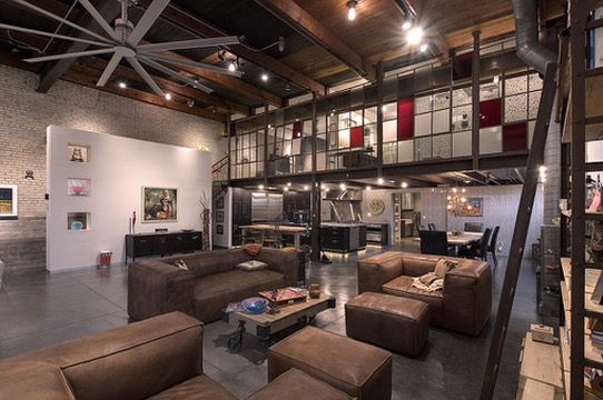 The Ignertia Building, industrial-style loft living room with exposed trusses