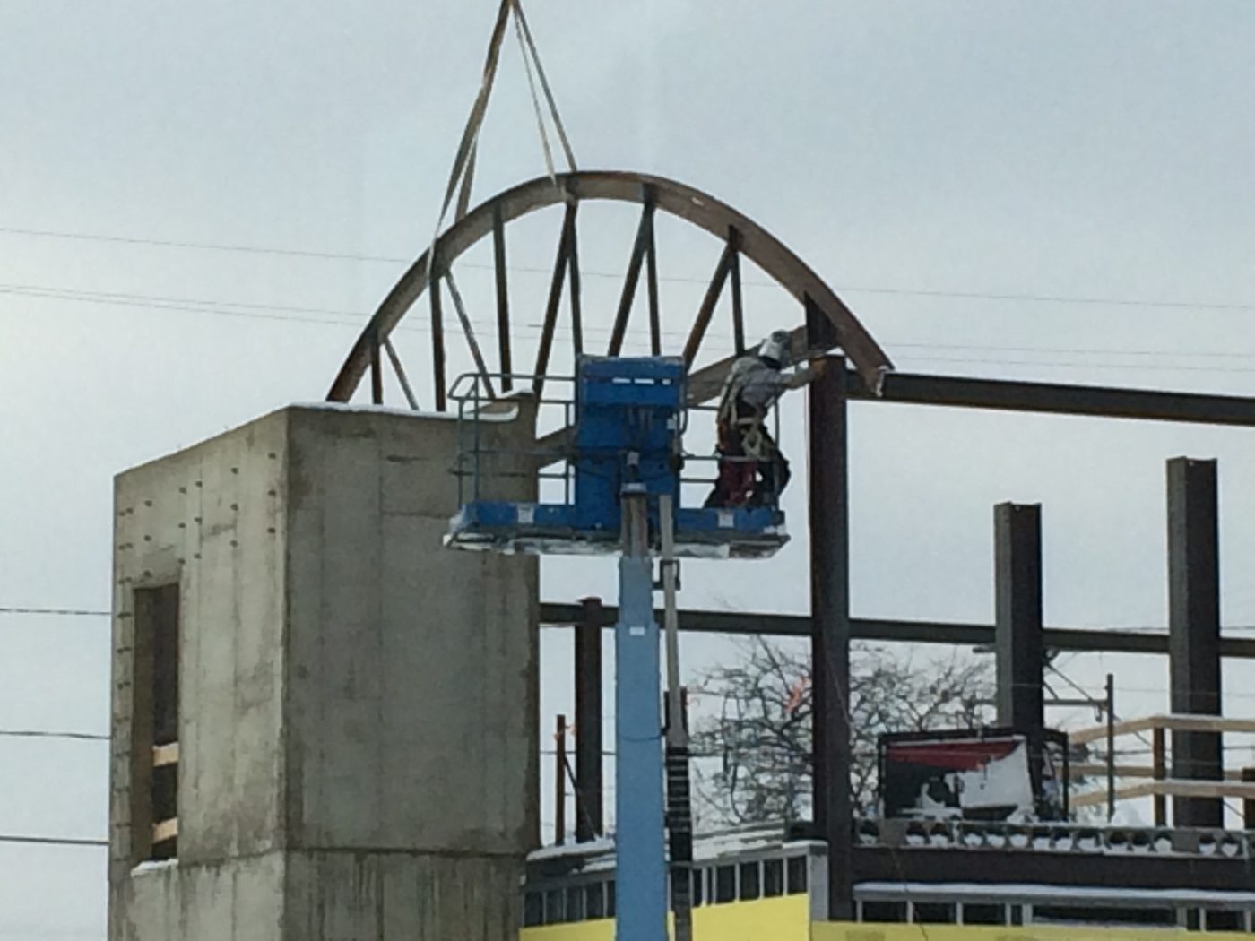 Norbridge Building, arched roof truss being set in place