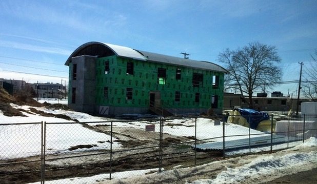 Norbridge Building, exterior wrapped in house wrap during construction